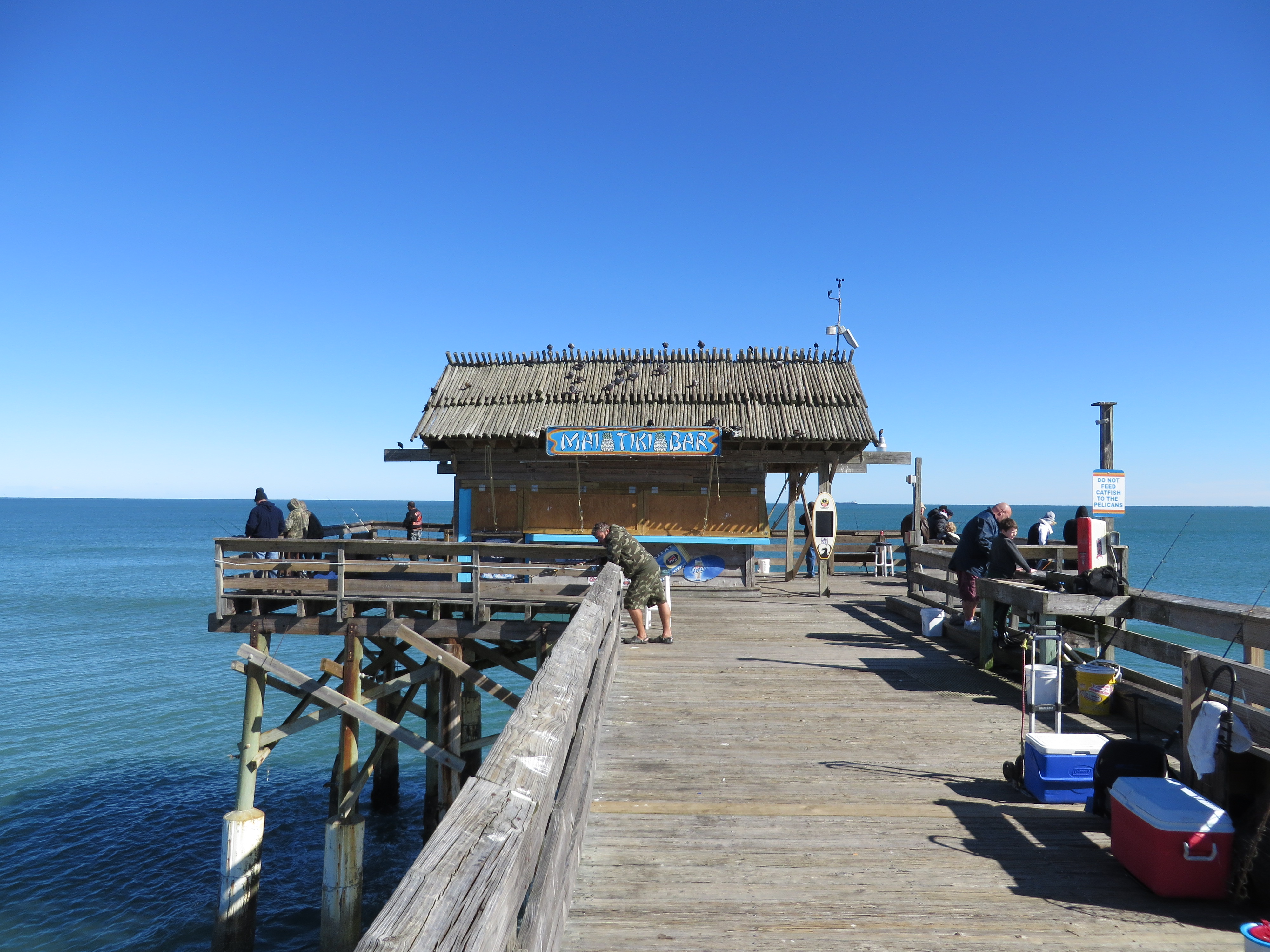 Cocoa Beach Pier in daylight, showing the modern pavilion and restaurant.