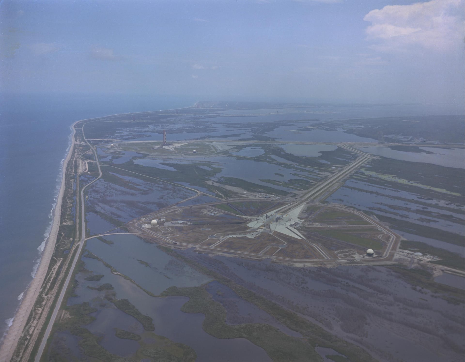 An aerial view of Pad 39A under construction on Merritt Island, looking south.