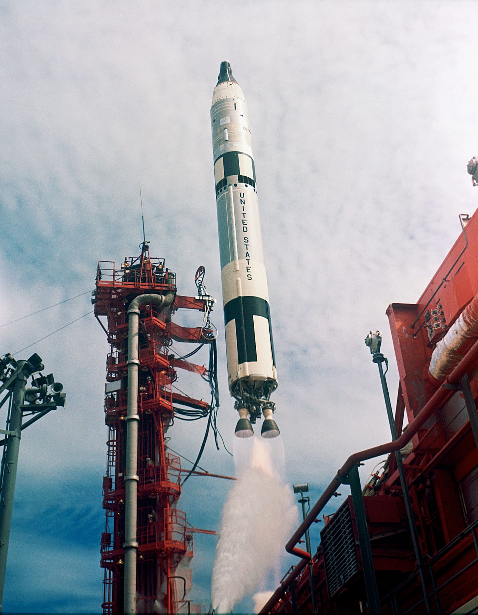 The Gemini-Titan 11 rocket rising past the umbilical tower at Complex 19.