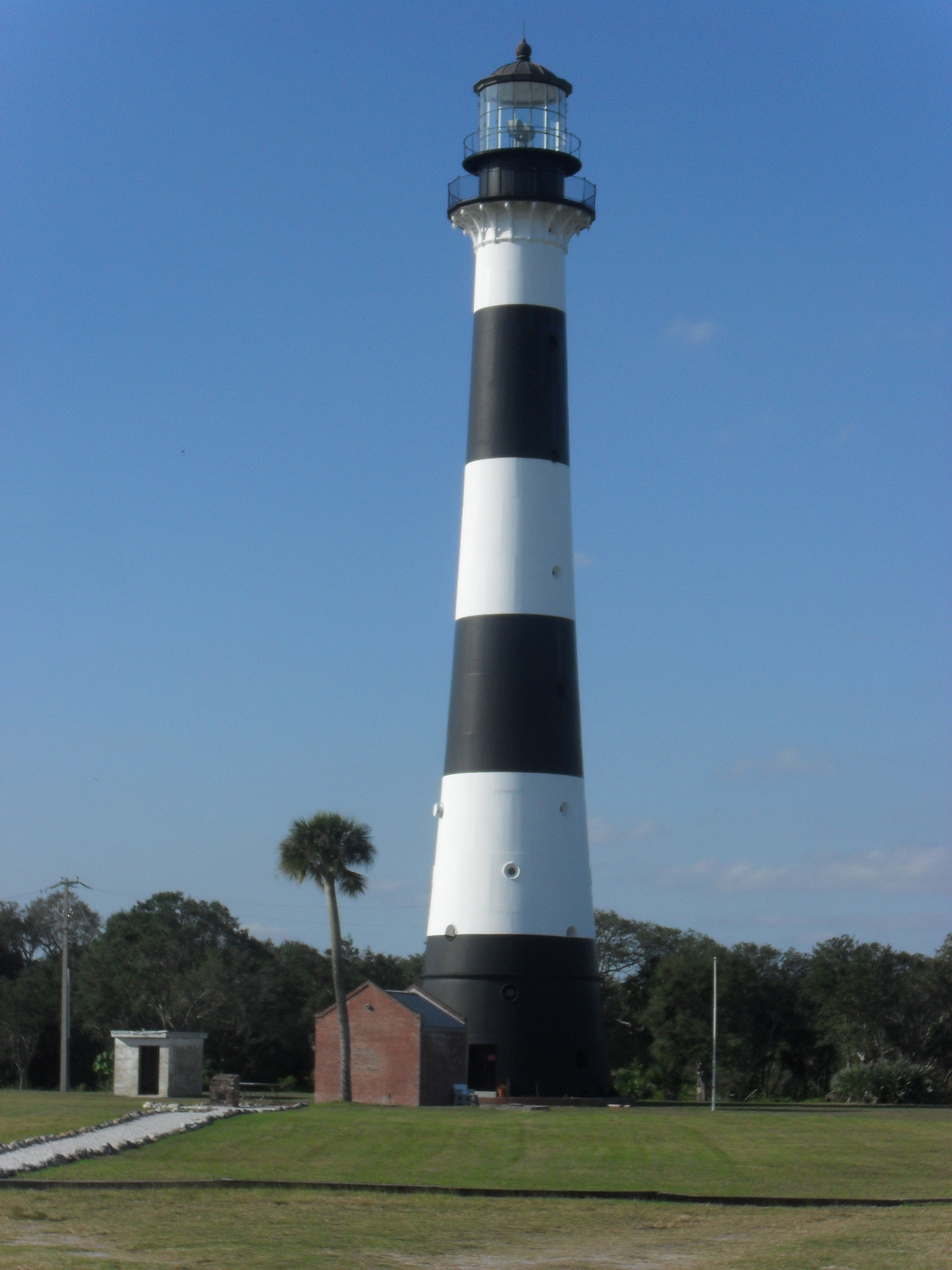 Cape Canaveral Lighthouse, iron tower painted in black and white bands, on the Space Force Station.